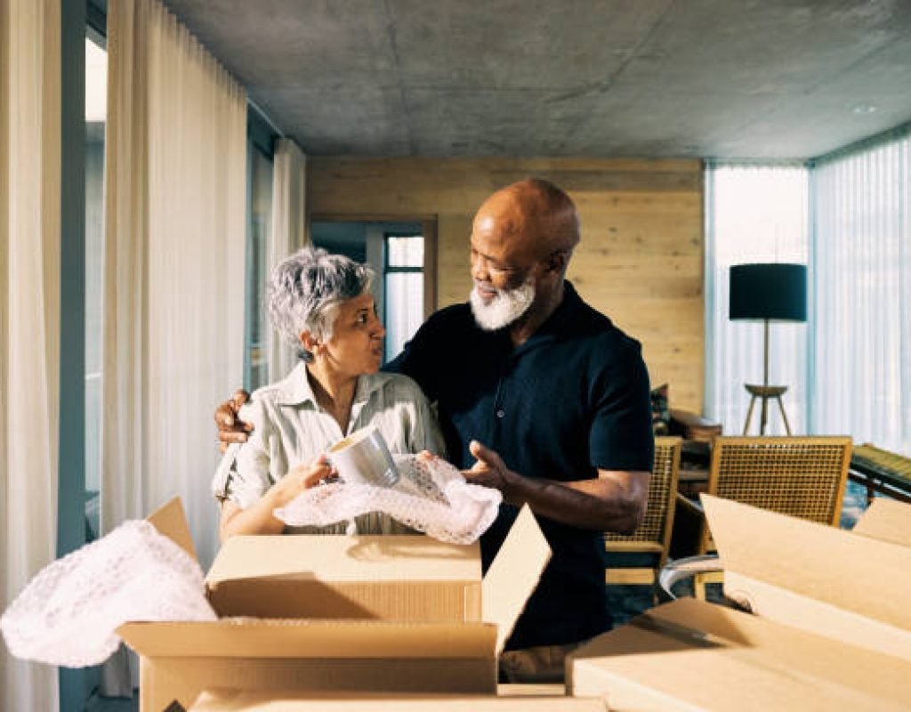 Caring moving team assisting seniors with packing and relocation needs smoothly