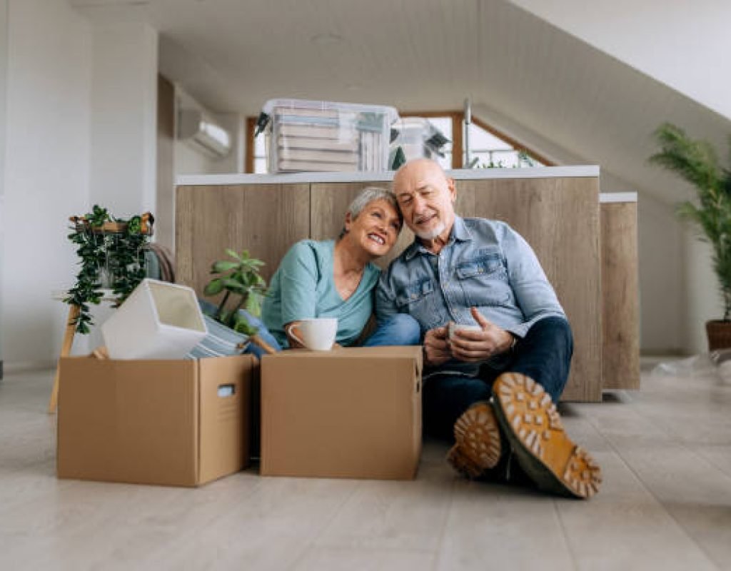 Senior relocation specialist labeling boxes for organized moving and unpacking help