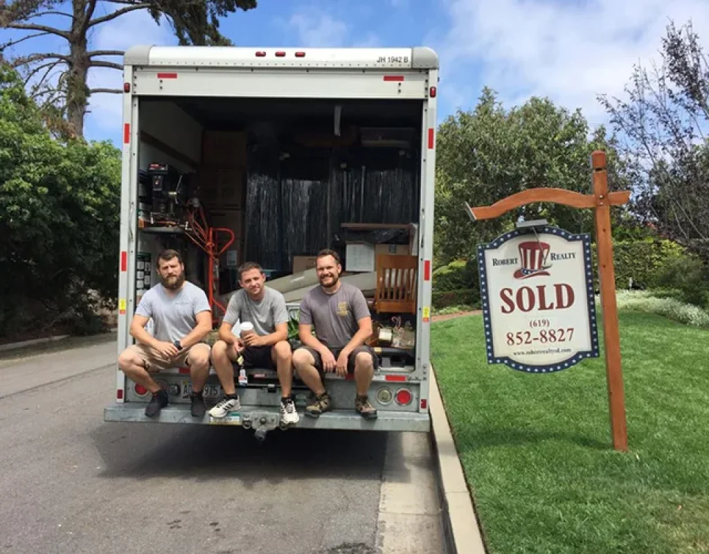 Professional packers organizing fragile belongings securely for stress-free moving experience.