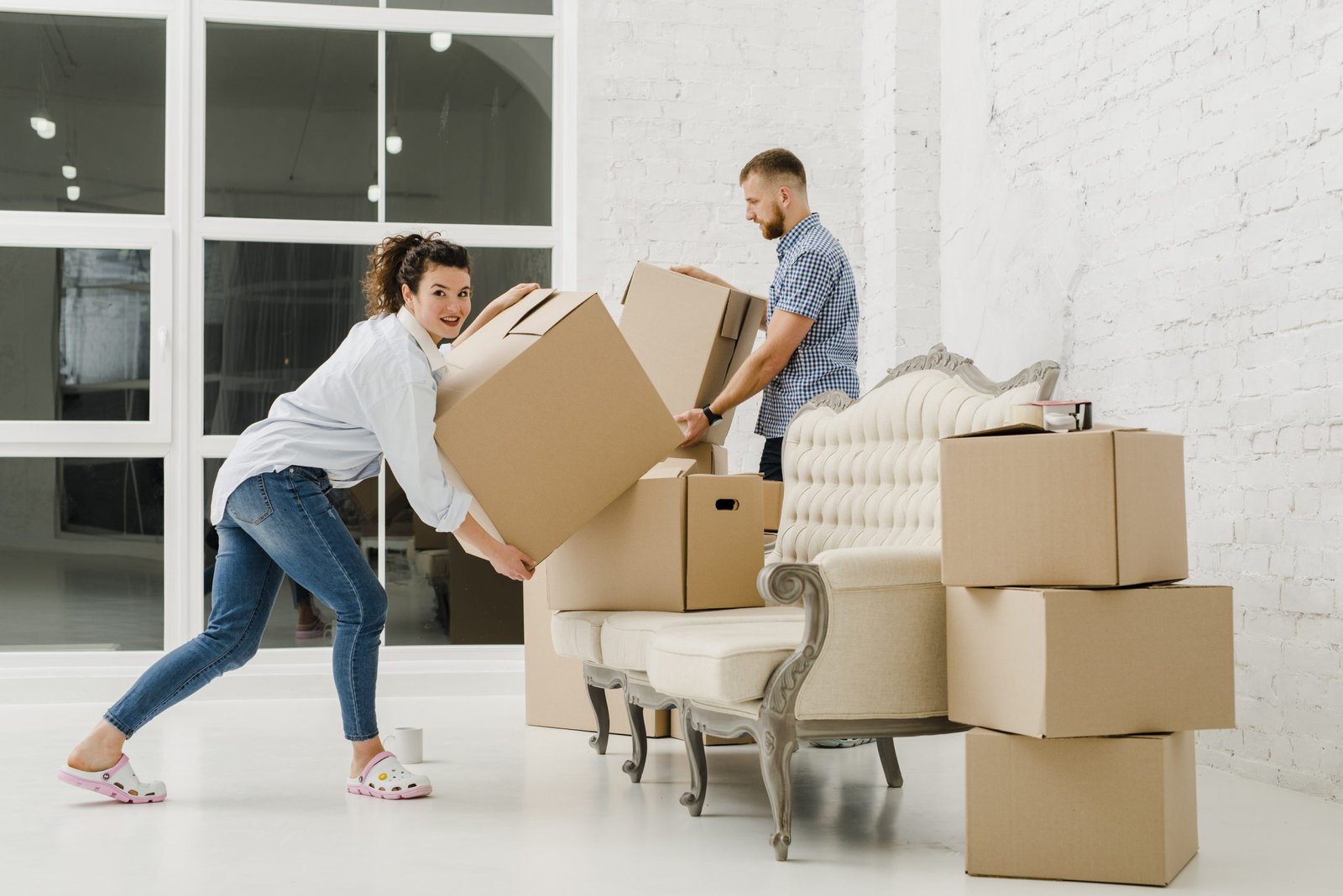 Professional movers packing and wrapping furniture in Encinitas home