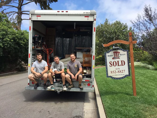 Professional packers organizing fragile belongings securely for stress-free moving experience.