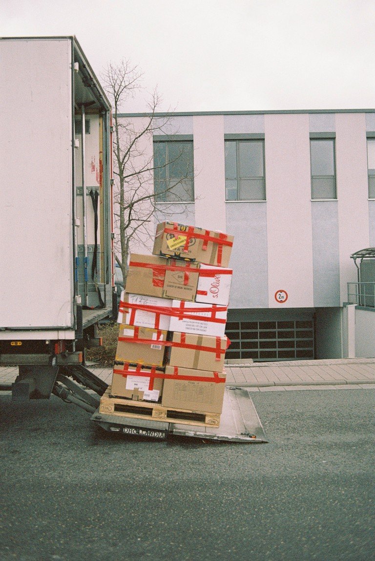 Stacked moving boxes being loaded onto a moving truck for interstate moving in Carlsbad, CA