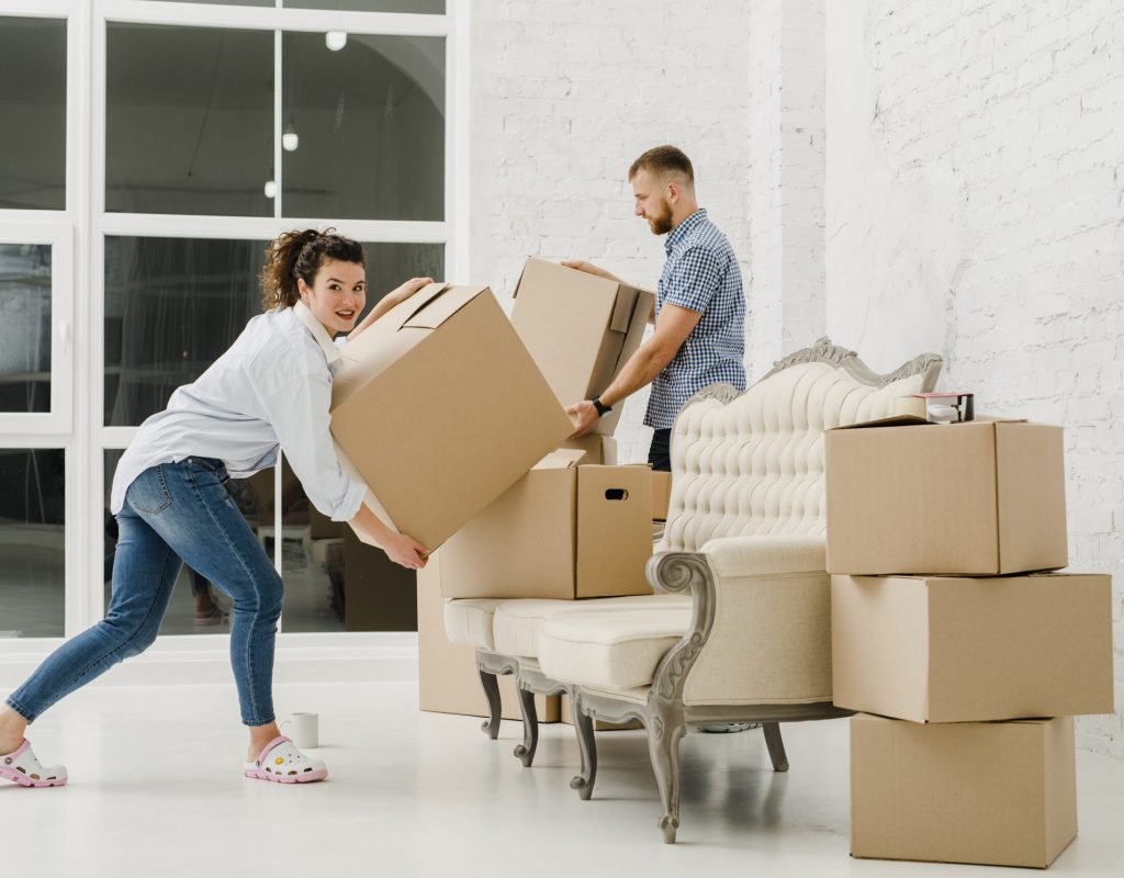 Professional movers packing and wrapping furniture in Encinitas home